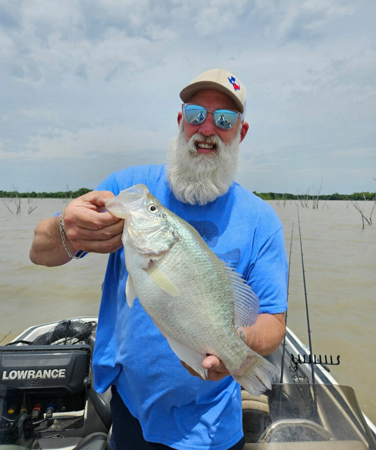 Chris Thompson, Tournament Director, holding crappie fish